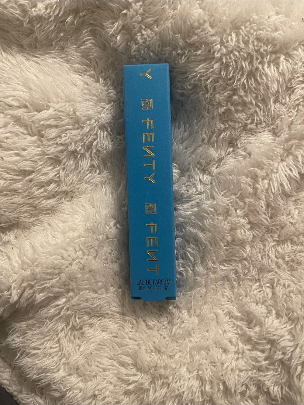 Fenty Beauty Fragrance Travel Spray in Bright Blue Packaging